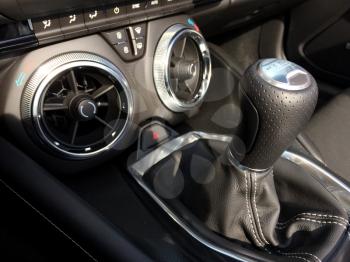Stick shift and air vents in car chevy camaro sports car