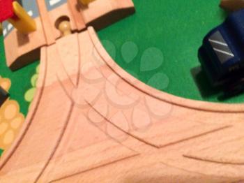 Merging road lanes in toy city play town in miniature train tracks
