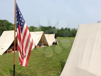 american civil war reenactment scene with white tent