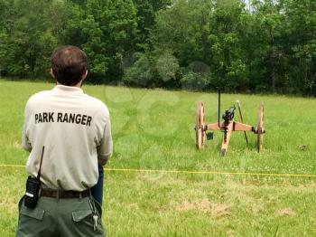 american civil war reenactment scene ranger watches canon