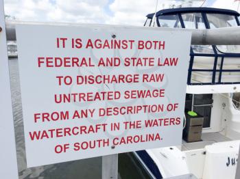 warning signs discharging sewage from boats to ocean or bay marina charleston south carolina