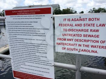 warning signs discharging sewage from boats to ocean or bay marina charleston south carolina