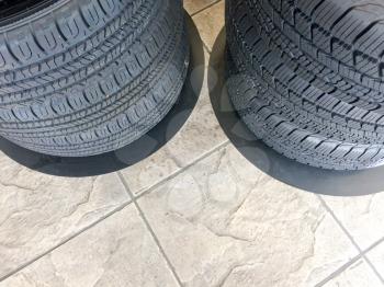 New tires in store on display by floor