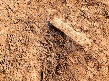 Baseball Pitchers mound with rubber step in brown dirt