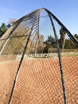 Baseball field backstop outdoor at park no people on sunny day