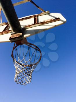 Basketball hoop with net outdoor court blue sky sunny play day