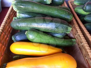 zucchini yellow squash in basket for sale farmers marketplace