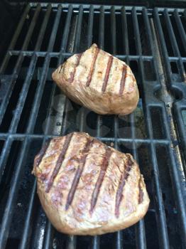 filet mignon grilled juicy cow beef on bbq barbecue grille background