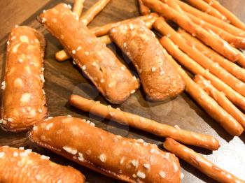 Pretzel sticks salted close up yummy snack on wood table