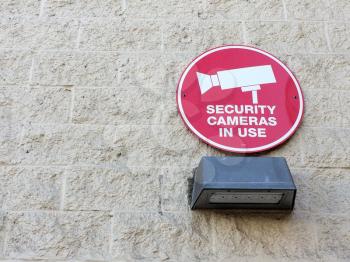 security cameras in use sign warning electronic devices are in use red circle