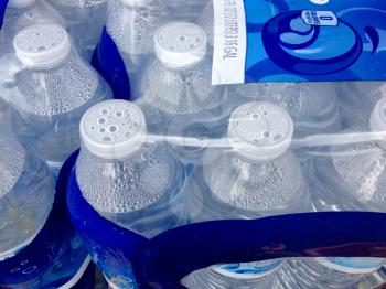plastic water bottle in cases with caps for sale supermarket