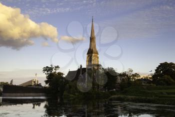 Copenhagen Denmark - September 13 2019: St. Alban's Church reflected in the water at sunset