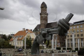 Malmo, Sweden: September 13, 2019: Statue of a gun with a knot as a non violence symbol designed by Carl Fredrik Reuterswärd, in the street of Malmo