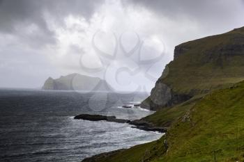 Mykines island on the horizon a view from Bour village, Vagar, Faroe Islands