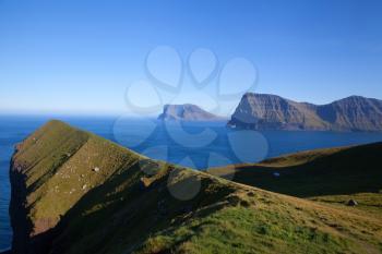 Kallur lighthouse hiking area on a bright sunny day with blue sky