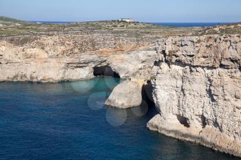 Crystal Lagoon caves view from ship, Comino, Malta