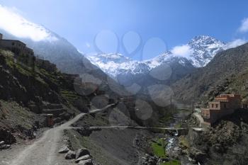 Hiking route to Toubkal Mountain from Imlil on a sunny day with the blue sky.