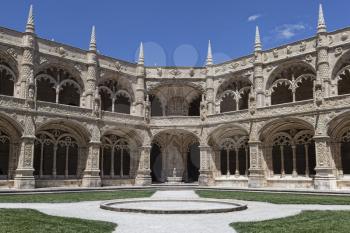 Cloister of Mosteiro dos Jeronimos (Hieronymites Monastery) without people in summer day with bright blue sky.