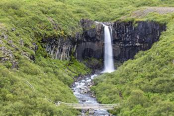 Svartifoss (Black Falls) is a waterfall in Skaftafell in Vatnajkull National Park in Iceland, and is one of the most popular sights in the park.