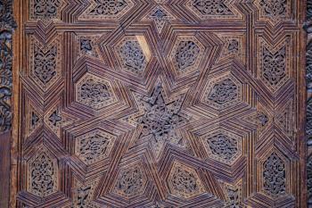 Elaborate decoration of ceiling with carved wooden patterns in Madrasa Bou Inani, Fez, Morocco