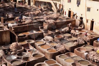 Men working on traditional leather tannery in Fez, Morocco