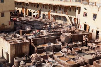 Men working on traditional leather tannery in Fez, Morocco