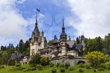 Peles Castle in Sinaia on a bright summer day with blue sky