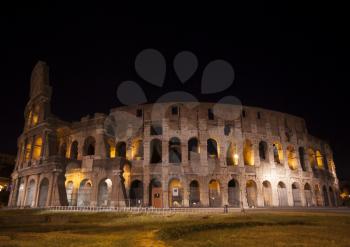 Colosseum is a background to the busy metropolis that is modern Rome.
