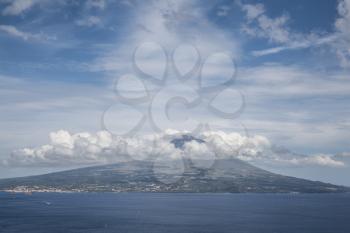 Mountain of PIco with clouds forming around its peak, a view from Faial, Azores, Portugal