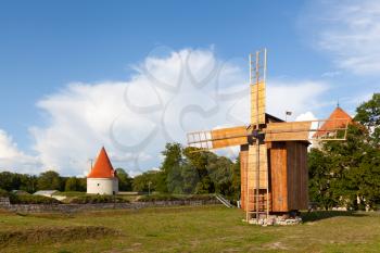 Kuressaare, Saaremaa, Estonia - 9 August 2019: The northern bastion tower at Kuressaare Castle amd windmill