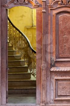 Beautiful ornate open old wooden door and staircase in Havana, Cuba. Symbol of opportunities