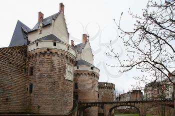 Nantes, France: 22 February 2020: Entrance gate and bridge to Castle of the Dukes of Brittany