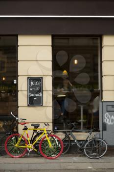 Yellow bicycle in front of a restaurant in Copenhagen