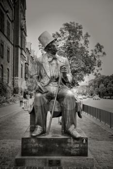 COPENHAGEN, DENMARK-SEPT 3, 2015: Sculpture of Hans Christian Andersen a prolific writer of plays, travelogues, novels, and poems, Andersen is best remembered for his fairy tales.  Black and white.