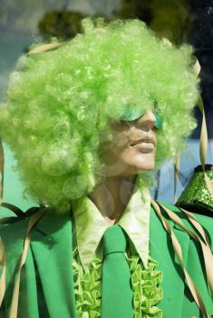 Mannequin in store with green wig and green outfit ready for halloween party