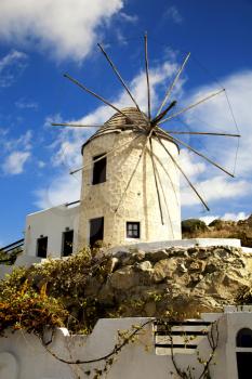 Windmill by a nice summer day in Naxos, Greece