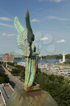 Angel monument and the clock tower in old Montreal, Canada