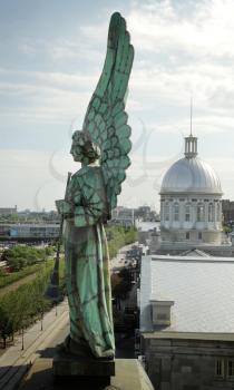 Angel monument and the dôme of Bonsecours market in old Montreal, Canada