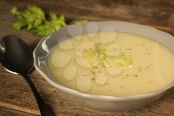 Celery soup on a rustic background