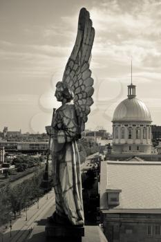 Angel monument and the dôme of Bonsecours market in old Montreal, Canada