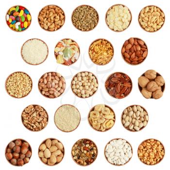 Collection of nuts, seeds and dried fruits on white background