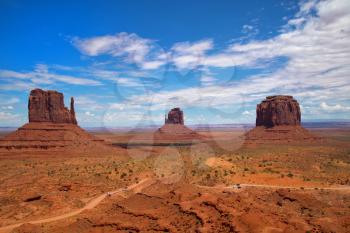 Monument Valley is a region of the Colorado Plateau characterized by a cluster of vast sandstone buttes.