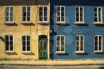 2 colourful houses in old Quebec city in Canada.  Picture from the street.