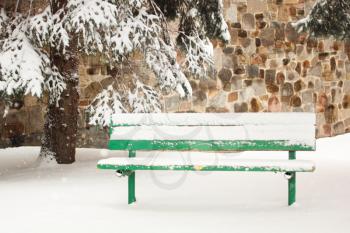 Bench full of snow in a park
