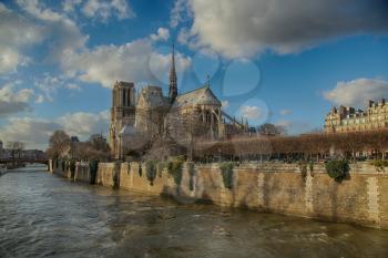 PARIS, FRANCE, MARCH 02 2015:  Back view of Notre Dame de Paris along the la Seine river in Paris, France.