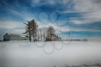 Farmhouse and building during winter season in Beauce area near Quebec, Canada