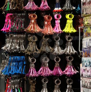 Eiffel tower key holders on a display in a tourist store in Paris, France.