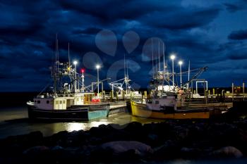 Fishing boats in the bay of Fundy in New Brunswick during the night