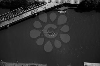 Top view of a dragon boat on the Yarra river in Melbourne in black and white
