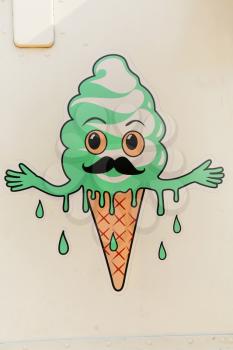 MONTREAL, CANADA,  JULY 3, 2015:  Graffiti of a ice sweating cream cone with mustach